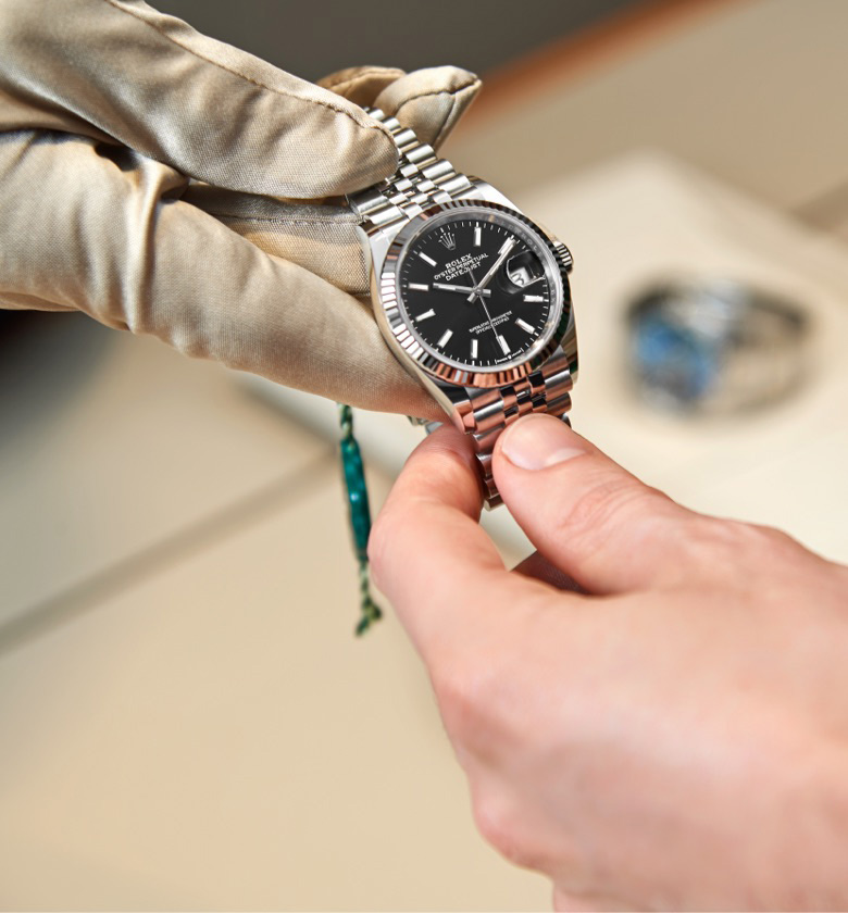 Handover of rolex watch to client
