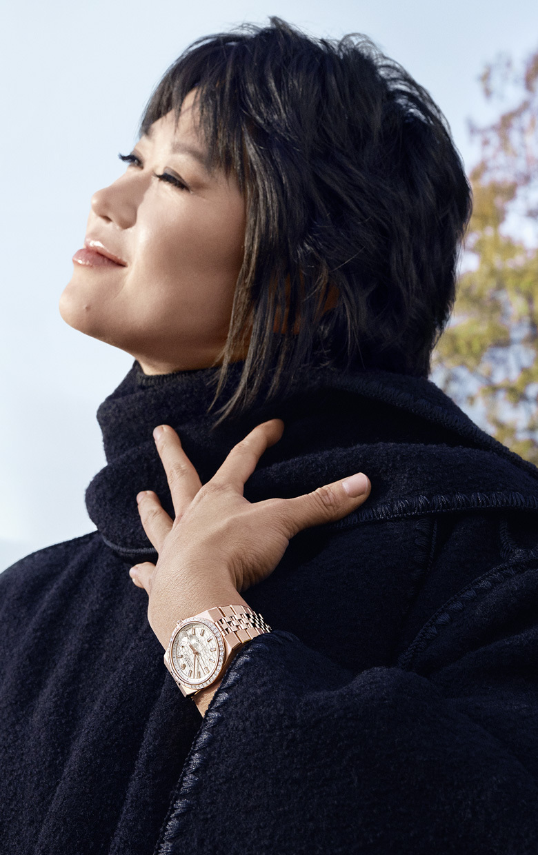 Person wearing a watch from the Rolex Land-Dweller collection.
